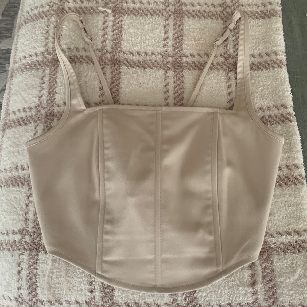 Kittenish tank with ruffle back